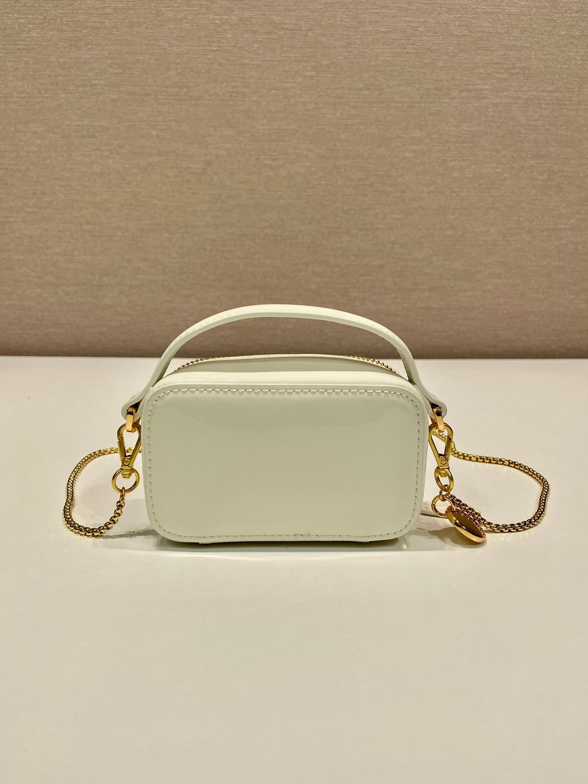 MINI HAND BAG 11 WITH GOLD STRAP IN WHITE PATENT CALFSKIN