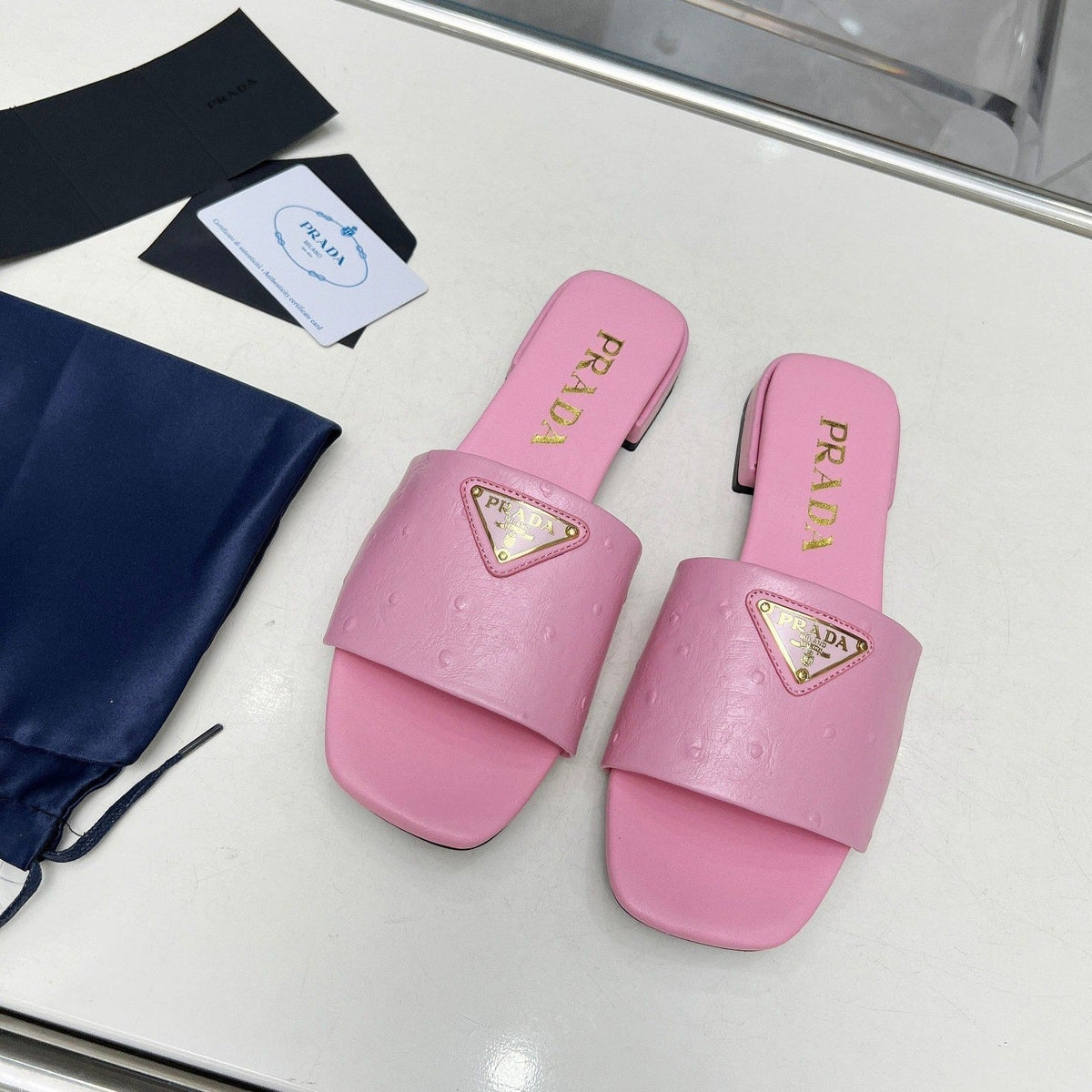 PRA SAFFIANO PATENT SLIDES OSTRICH MOTIF PINK CALFSKIN